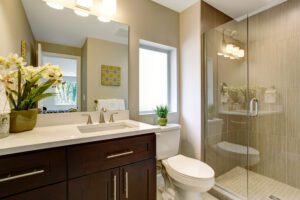 Small bathroom with a glass enclosed shower 